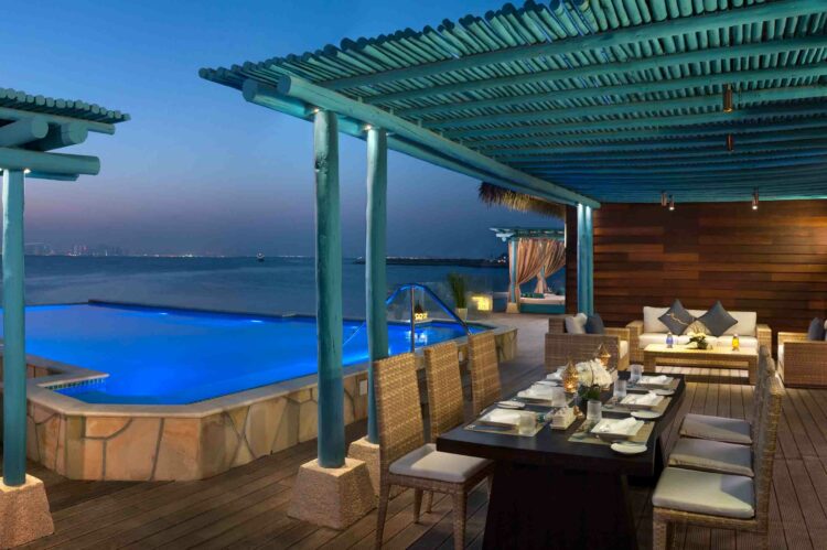 Banana Island Resort Doha By Anantara Guest Room Three Bedroom Anantara Over Water Villa Pool Deck Night