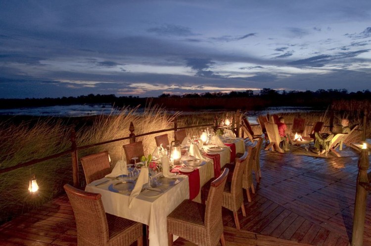 Africa; Botswana; Okavango Delta; Baines' Camp; Dinner On Deck At Sunset